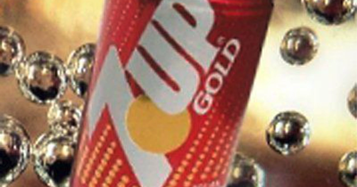 7UP 7Up Gold red soda can on a gold background with beads