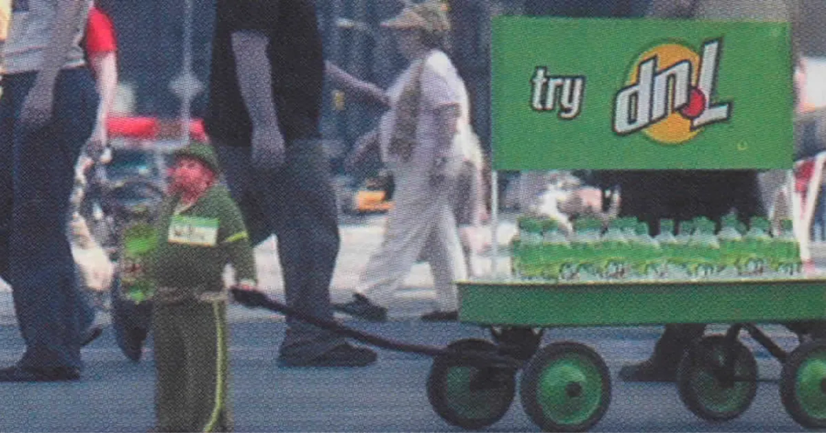 7UP dnL soda street promotion with a green wagon of bottles