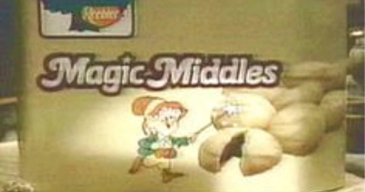 Ernie the Elf and a split-open Magic Middle on the original packaging — Keebler Keebler Magic Middles package close-up with Ernie the Elf and a fudge-filled shortbread cookie