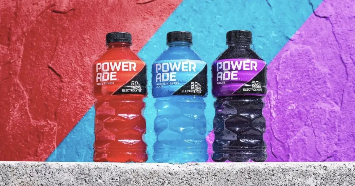 The Coca-Cola Company Powerade Fruit Punch, Mountain Berry Blast and Grape bottles on wall