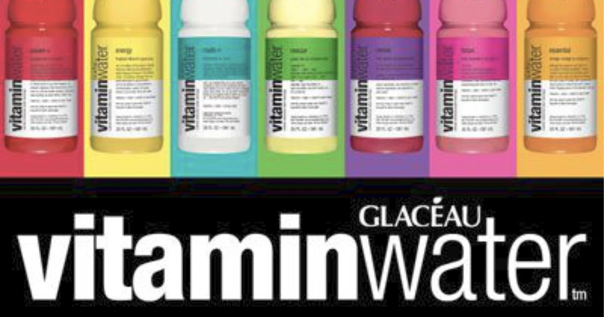 The Coca-Cola company Glacéau vitaminwater logo above a row of colored flavor bottles