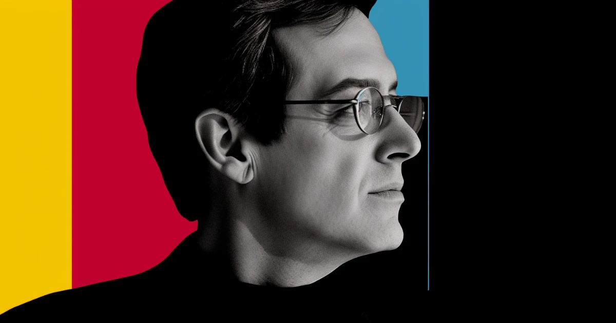 Profile portrait of a man in round glasses © History Oasis Profile portrait of a man in round glasses against yellow and red panels