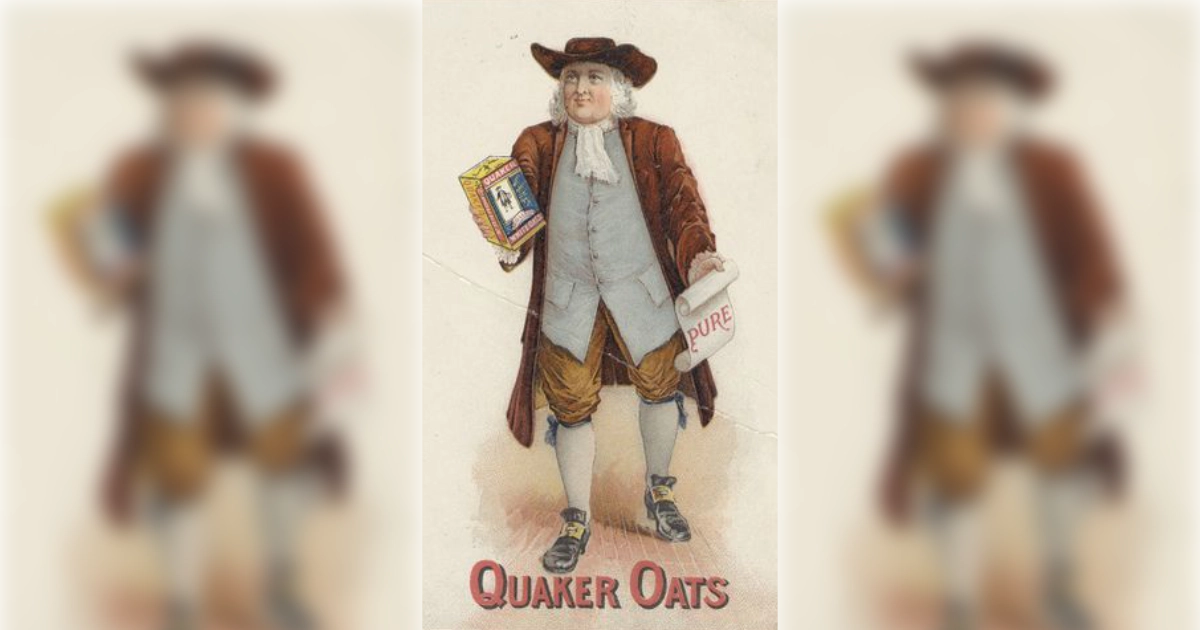 Quaker man mascot in brown coat and hat holding an oats box