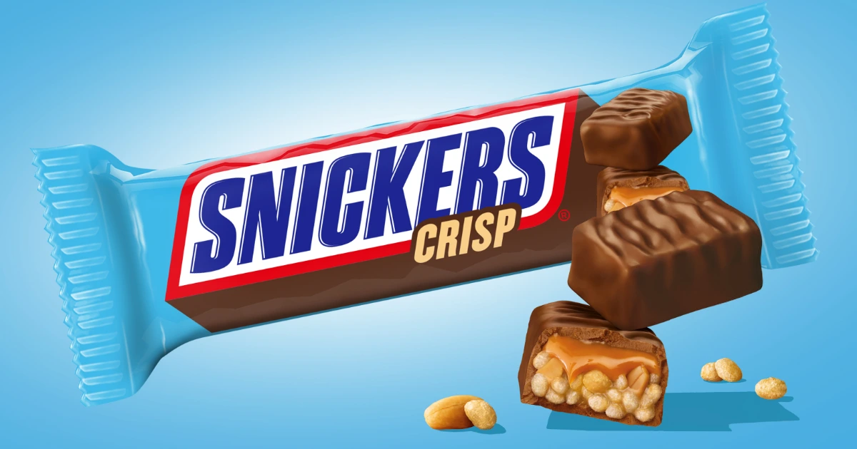 Snickers Crisp bar in a blue wrapper beside cut pieces and peanuts