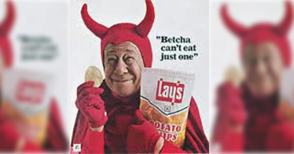 Frito-Lay Bert Lahr in a red devil costume holding a Lay's chips bag