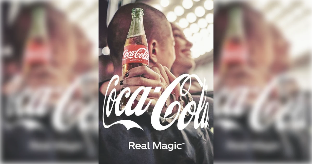 The Coca-Cola Company couple embracing with a glass Coca-Cola bottle in Real Magic ad