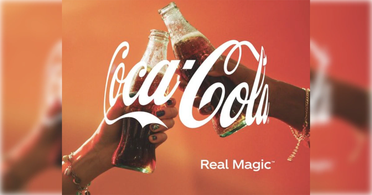 The Coca-Cola Company two hands toasting Coca-Cola bottles in Real Magic campaign ad