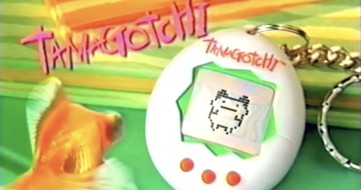 Bandai White original Tamagotchi digital pet with keychain and pixel creature