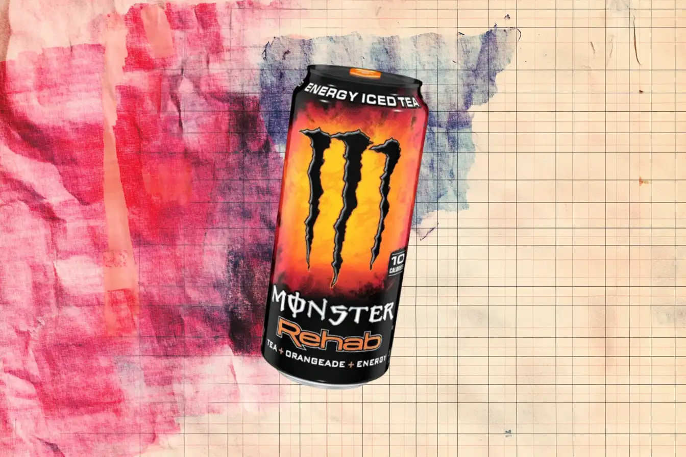 The Monster Rehab Tea + Orangeade can, labeled Energy Iced Tea — Monster Energy Orange Monster Rehab Tea plus Orangeade energy iced tea can