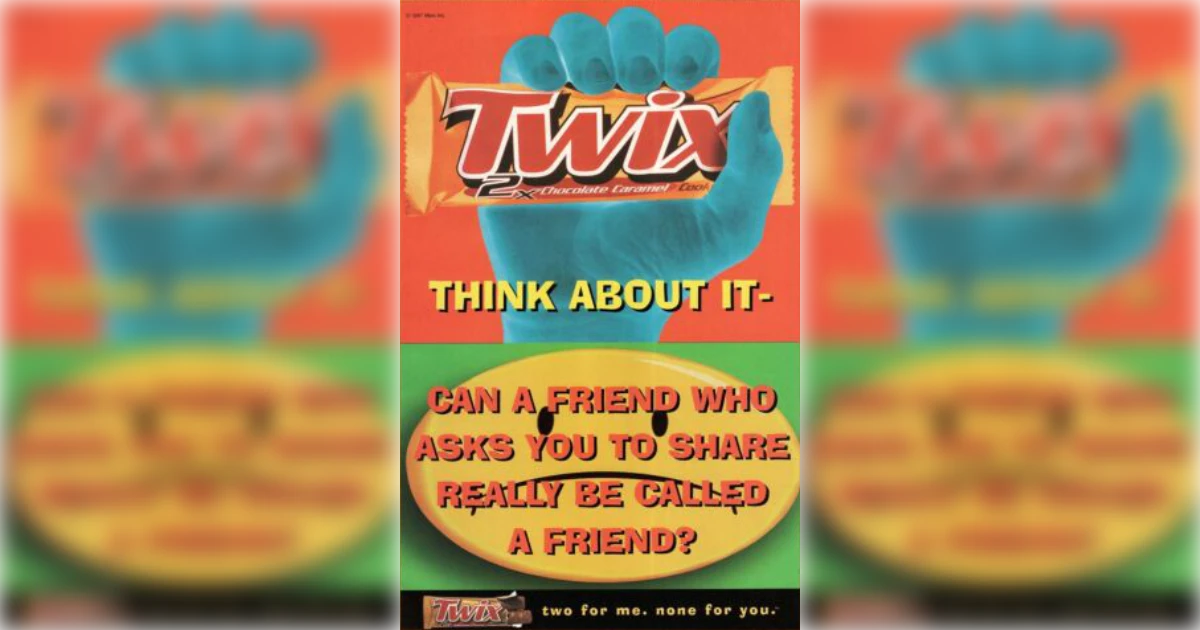 Mars, Inc. Vintage Twix print ad with blue hand holding a Twix bar
