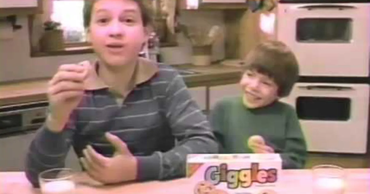 Nabisco Two kids eating cookies beside a Giggles box in a 1980s TV commercial