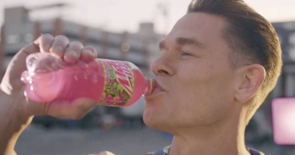 PepsiCo Man drinking a pink Mtn Dew Major Melon bottle outdoors