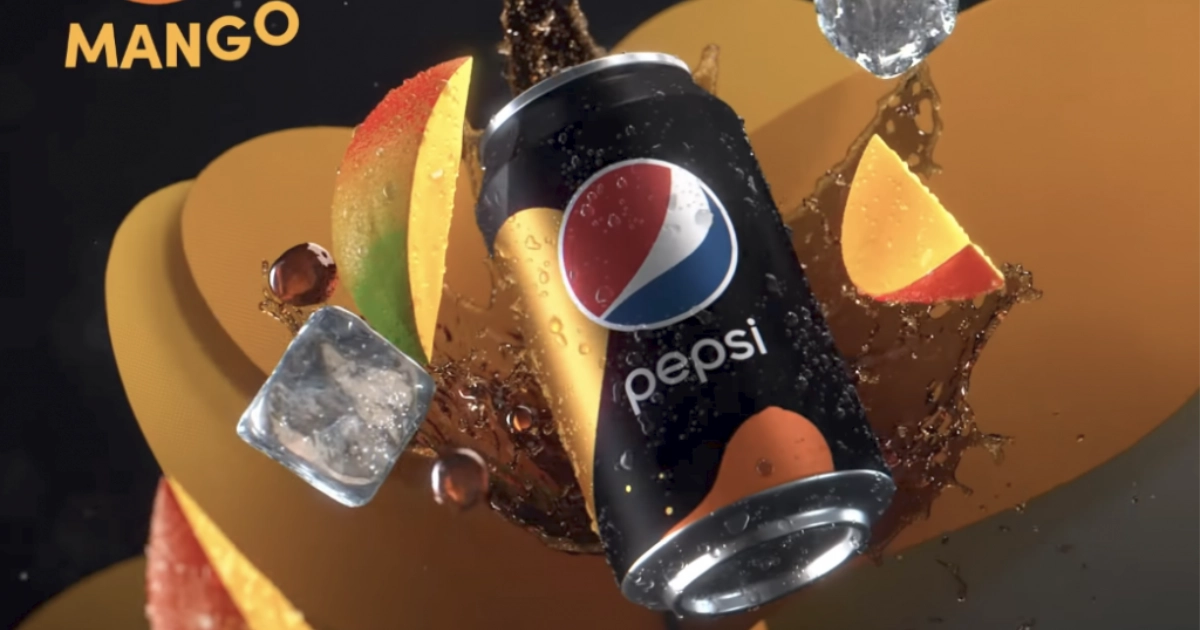 Black Pepsi Mango can amid mango slices, ice cubes and cola splash