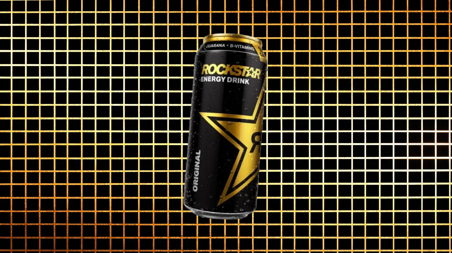 PepsiCo Rockstar Original energy drink can in black and gold on grid background