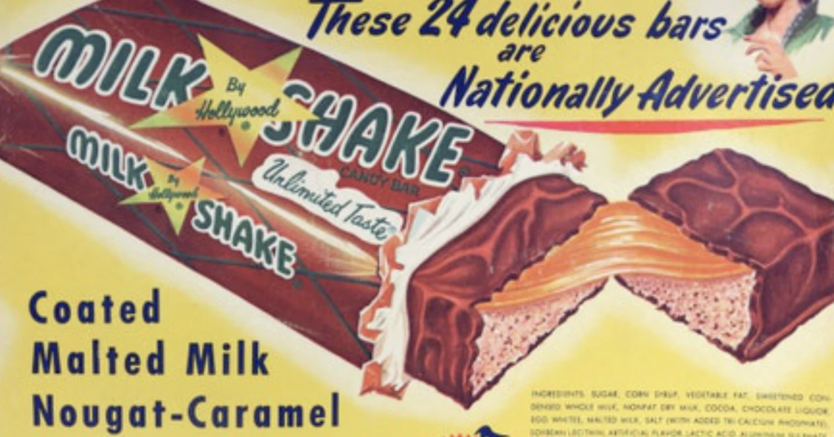 Curtiss Hollywood Milk Shake candy bar display ad with cut bar showing nougat