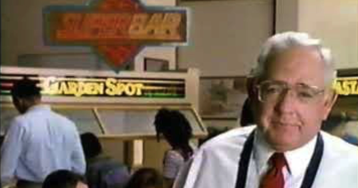 Wendy's Dave Thomas standing in front of Wendy's SuperBar Garden Spot buffet