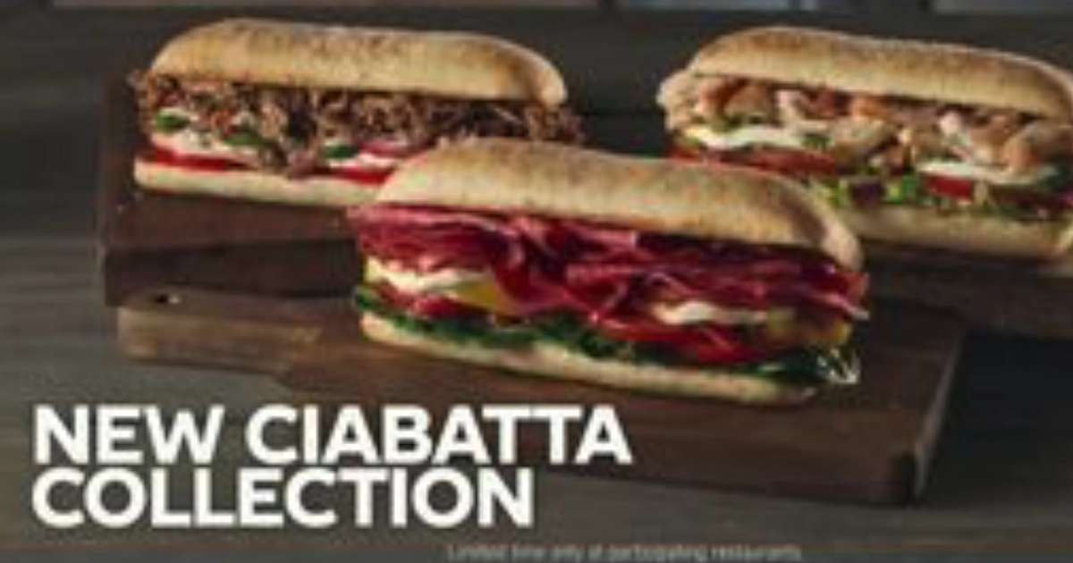 Subway Three Subway Ciabatta Collection sandwiches on a wooden board