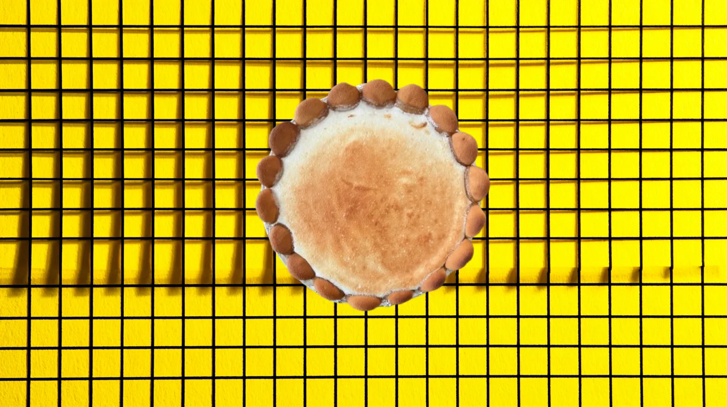 Whole lemon pie edged with vanilla wafers, overhead view