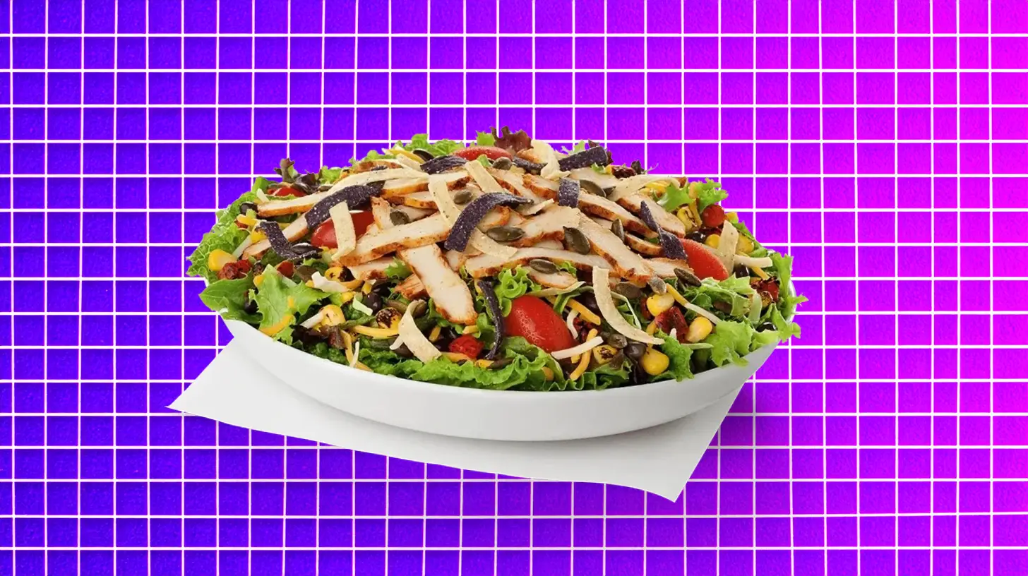 Chick-fil-A salad bowl with grilled chicken, tortilla strips, corn, and tomatoes