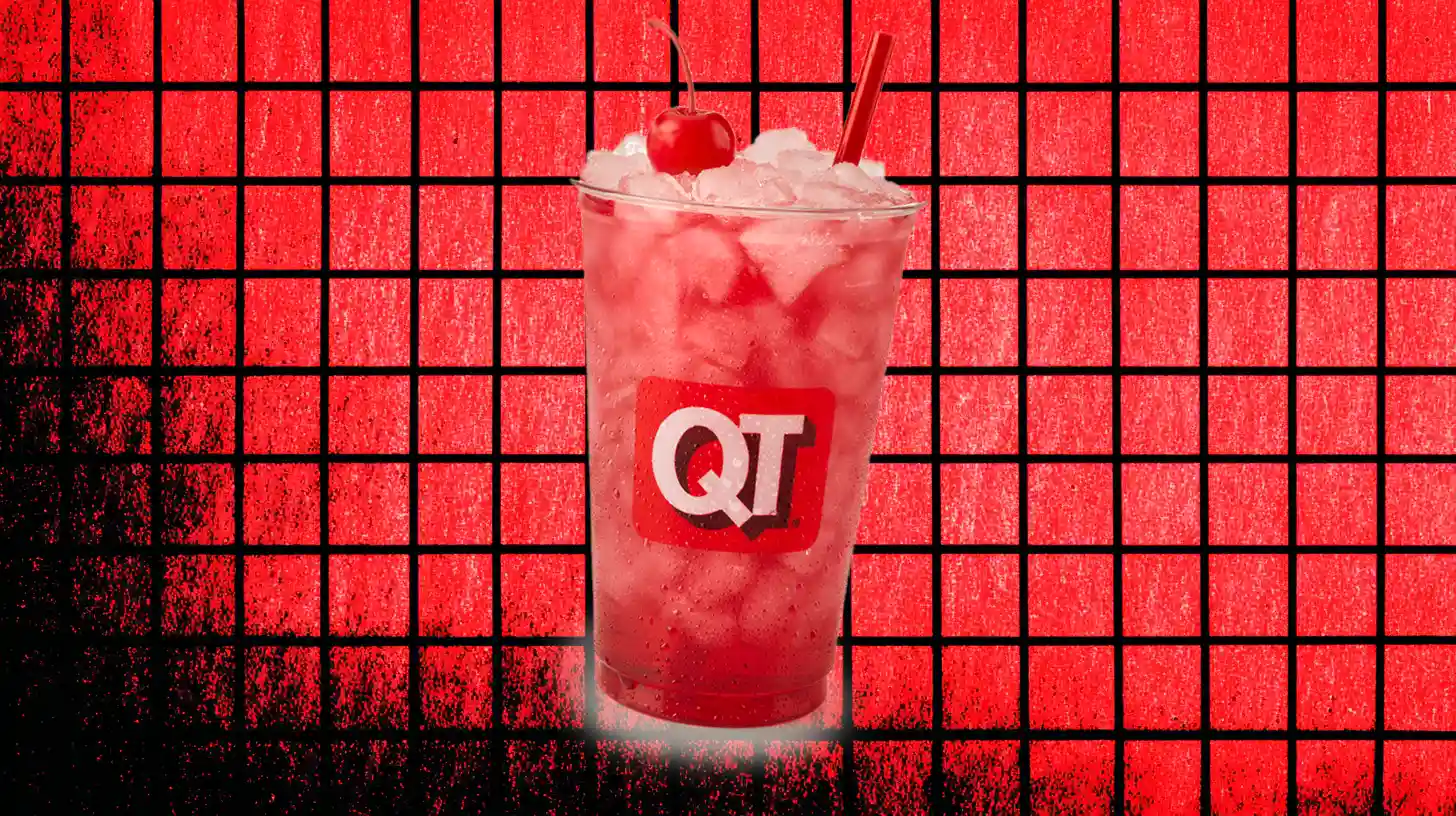 QuikTrip cup of red cherry drink over crushed ice with straw