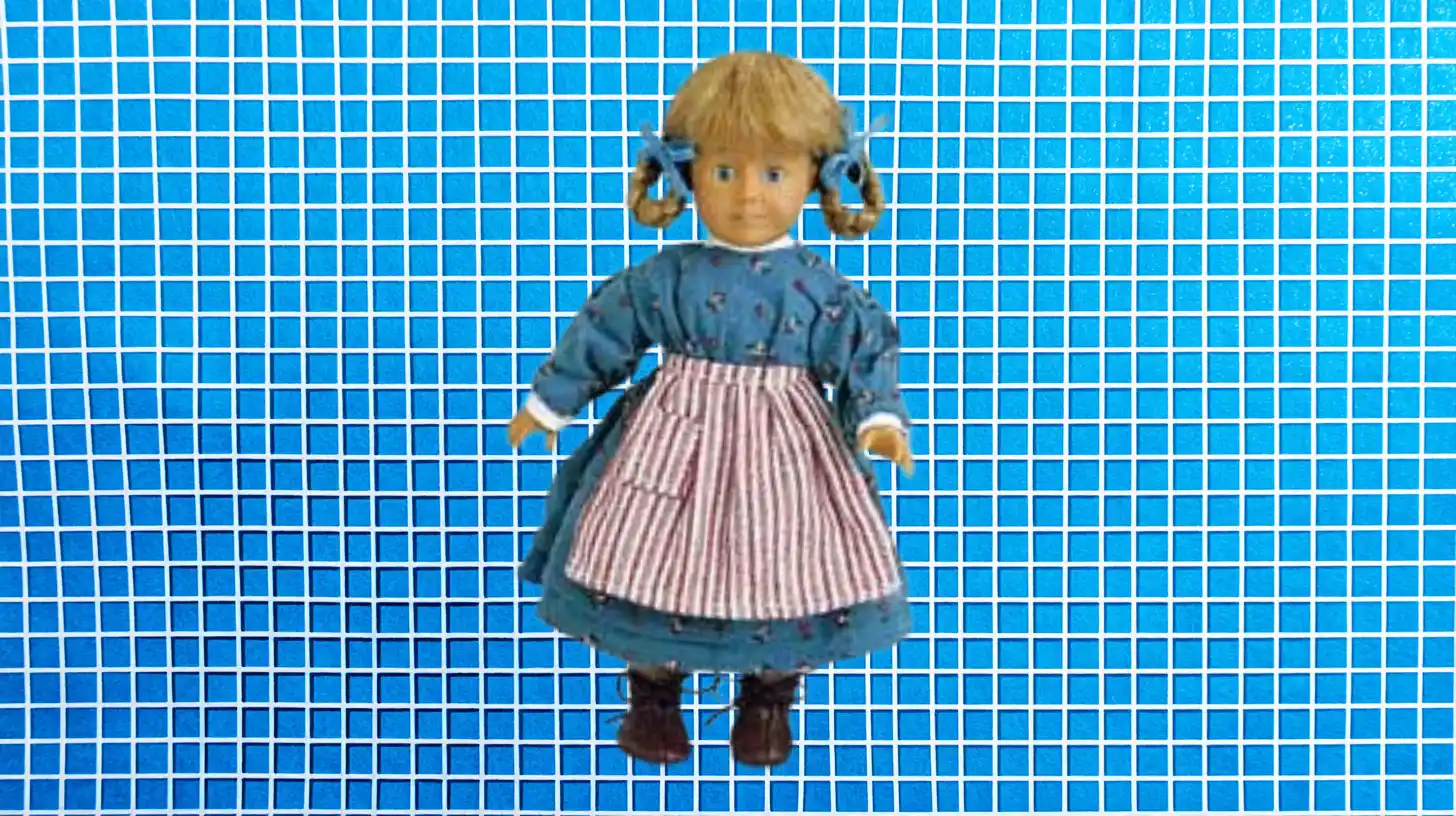 Mattel Kirsten Larson American Girl doll in blue prairie dress and striped apron