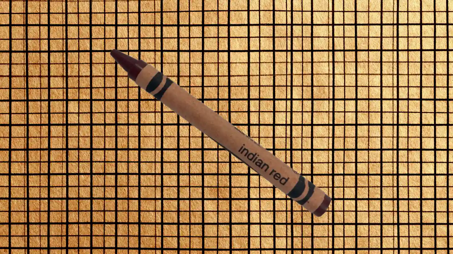 Crayola Indian Red crayon with tan wrapper and dark maroon tip