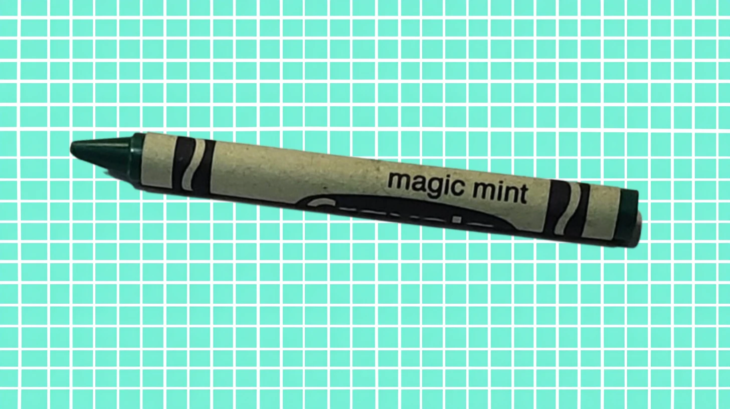 Crayola Magic Mint crayon with pale green wrapper and dark green tip