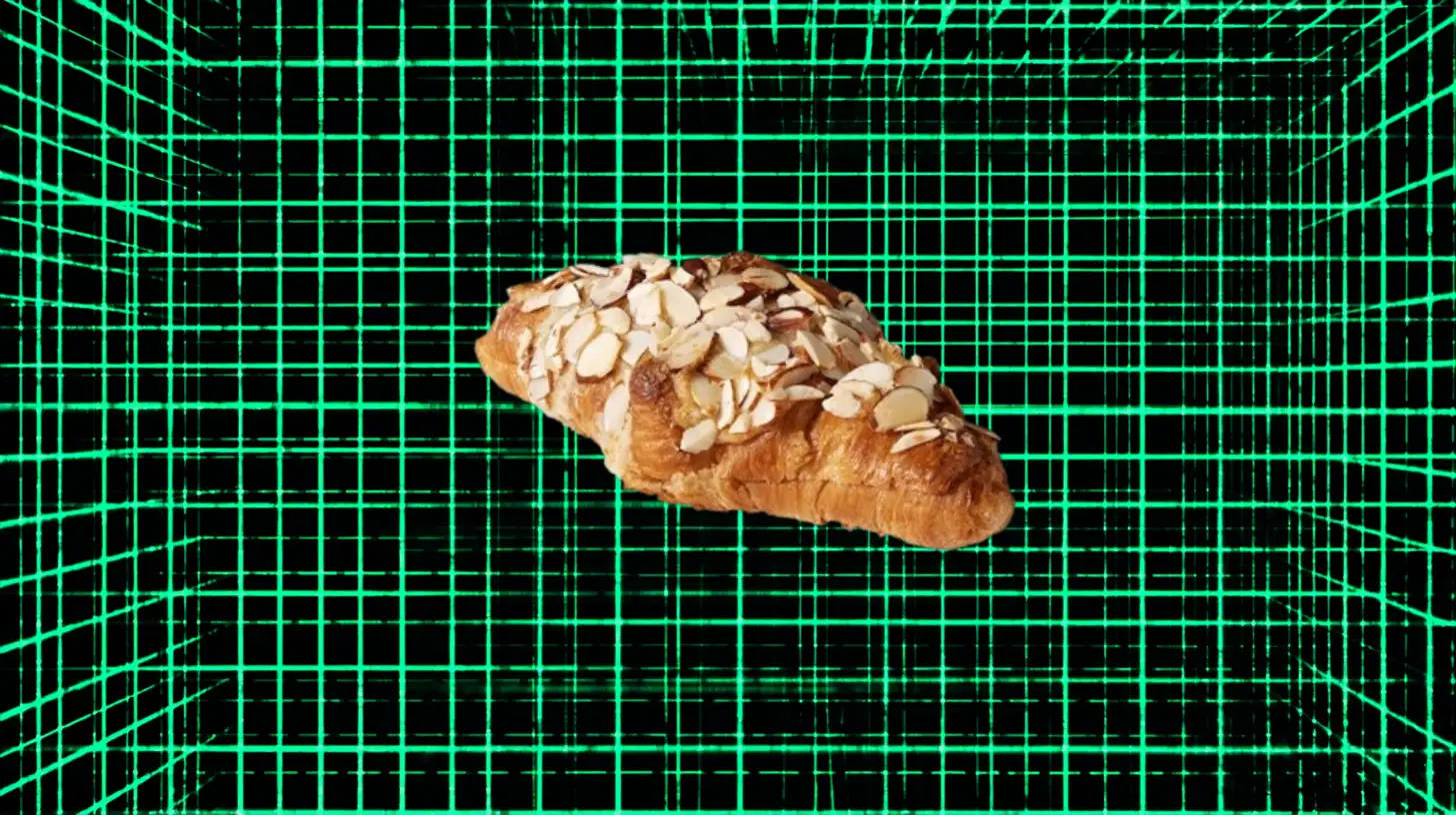 Starbucks Starbucks almond croissant topped with sliced almonds on green grid