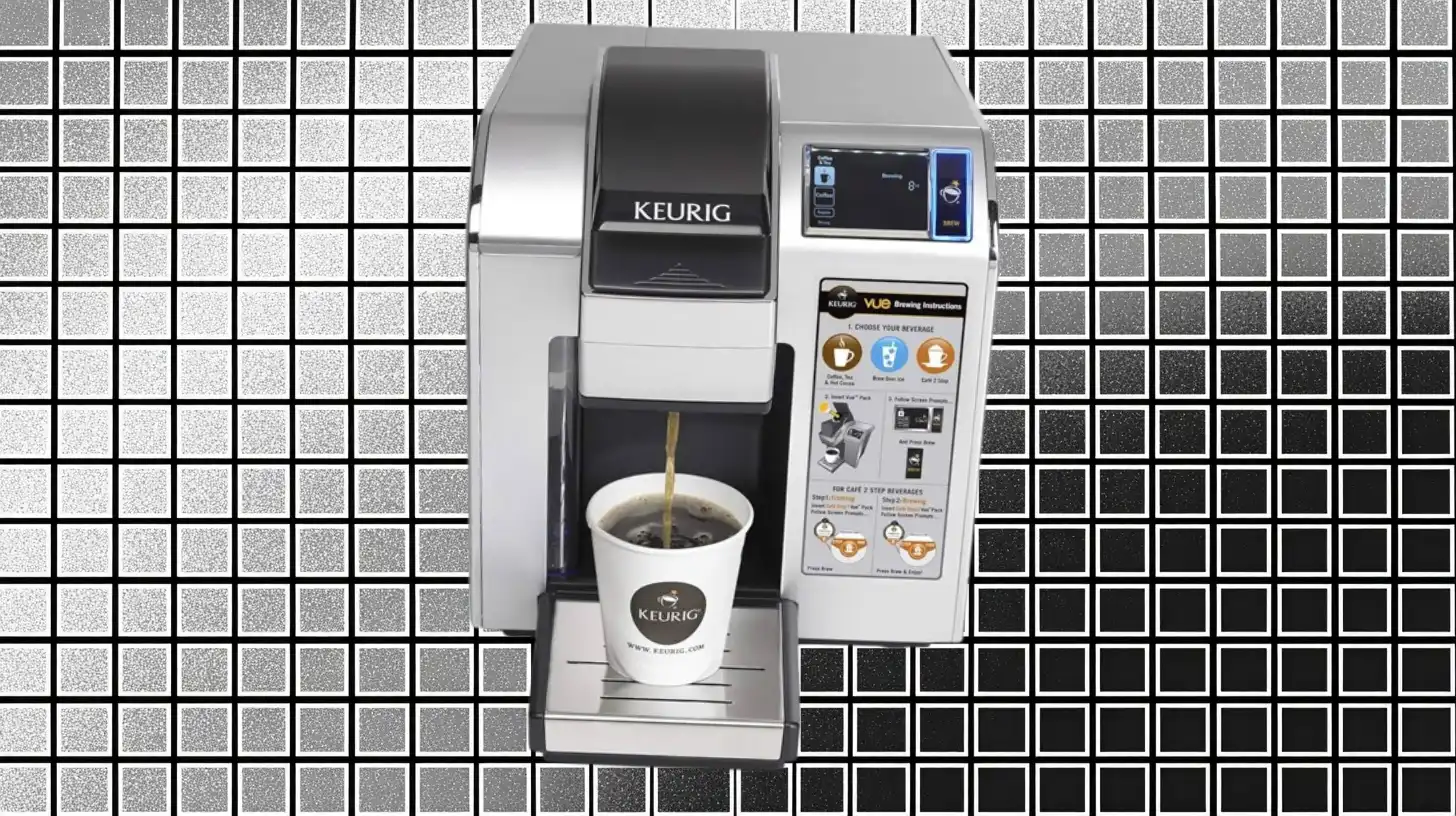 Keurig Keurig Vue brewer dispensing coffee into a branded paper cup