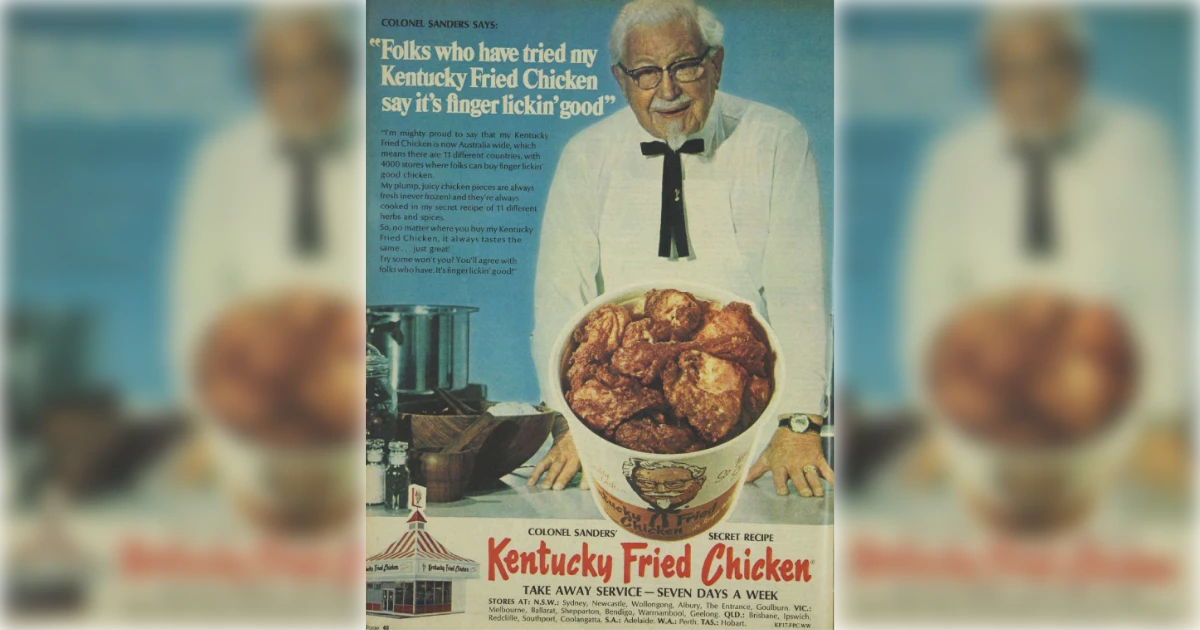 Colonel Sanders in an early Kentucky Fried Chicken newspaper ad — KFC Colonel Harland Sanders in his white suit beside a bucket of fried chicken in a vintage KFC print ad