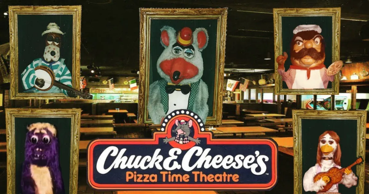Chuck E. Cheese and the animatronic band at a Pizza Time Theatre location — Chuck E. Cheese The Chuck E. Cheese animatronic band on stage beneath a Pizza Time Theatre sign