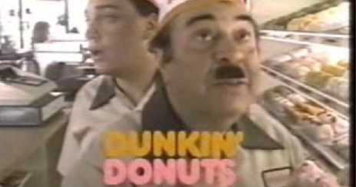 Fred the Baker and the “Time to make the donuts” campaign — Dunkin' Donuts Fred the Baker in his white uniform and cap in a Dunkin' Donuts commercial still