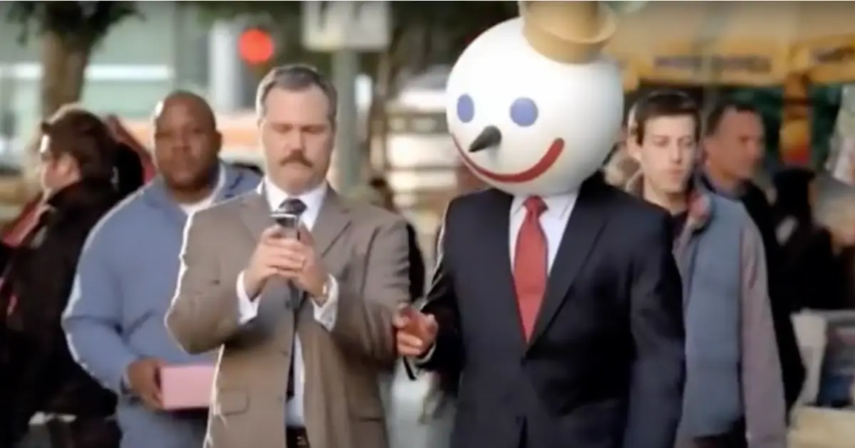 Jack in the Secret Weapon era — Jack in the Box Jack Box mascot walking a city street among businessmen
