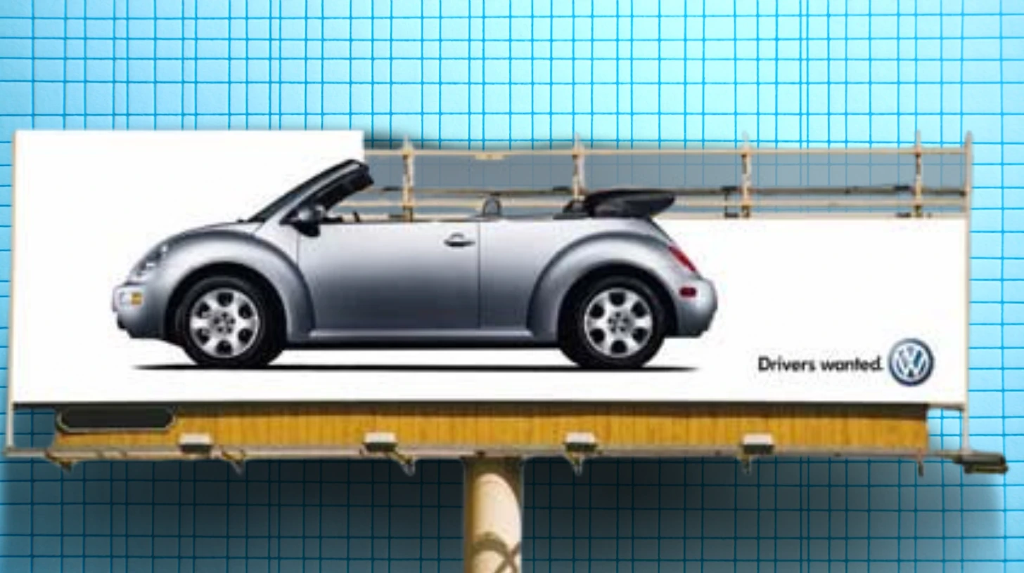 Volkswagen New Beetle Convertible billboard with the Drivers wanted tagline