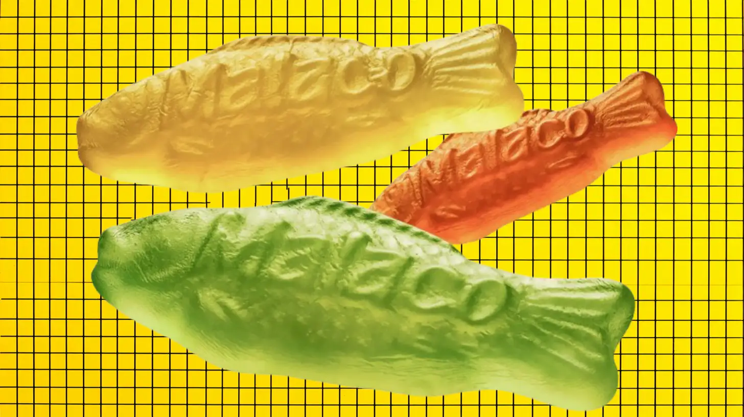 Malaco Three Malaco-embossed gummy fish candies in yellow, red, and green