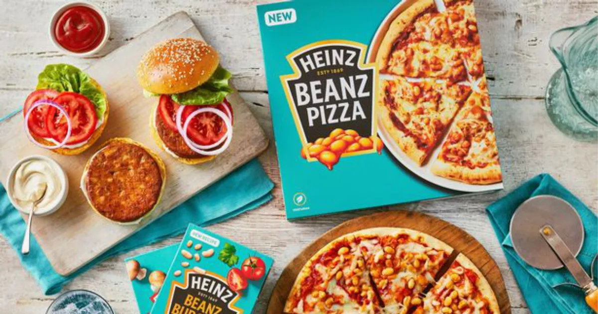 Heinz Beanz Pizza box beside a baked bean pizza and bean burgers