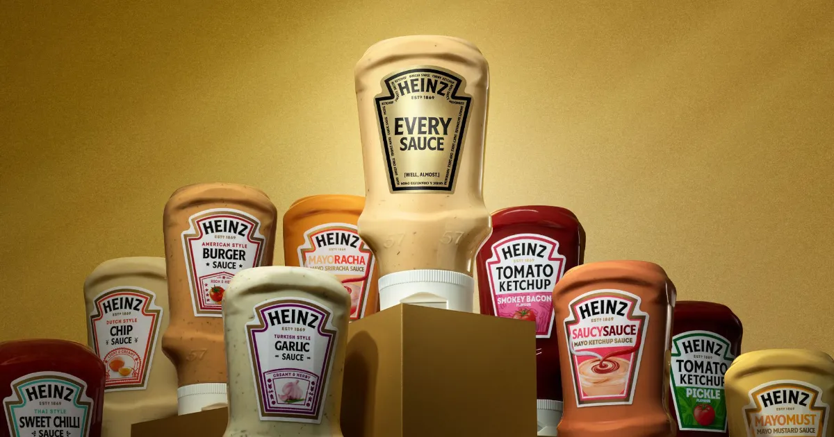 Heinz Every Sauce bottle towering over a lineup of Heinz sauce bottles