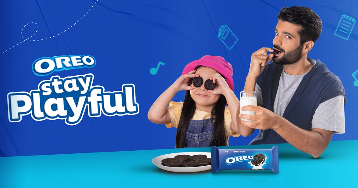 Nabisco Oreo Stay Playful ad with girl holding cookies over her eyes