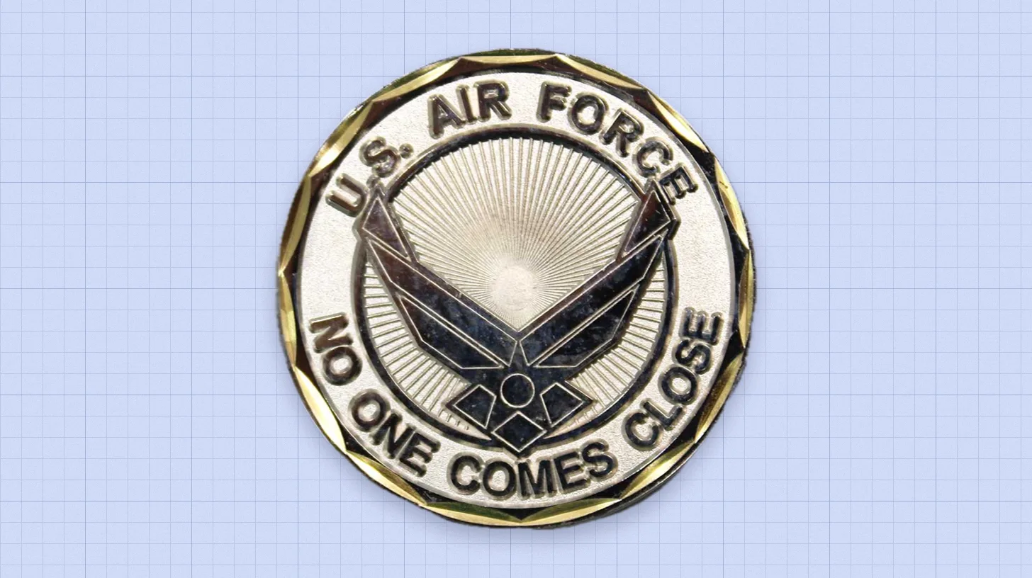 A challenge coin carrying the 2000 slogan around the Air Force symbol / U.S. Air Force U.S. Air Force challenge coin reading No One Comes Close around the wing symbol