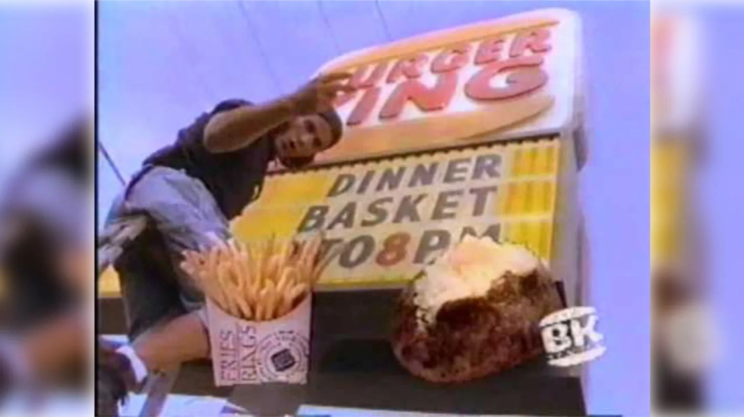 Updating the marquee for Dinner Baskets, served until 8 p.m. — Burger King Still from a 1992 Burger King commercial with a worker updating a Dinner Baskets marquee sign