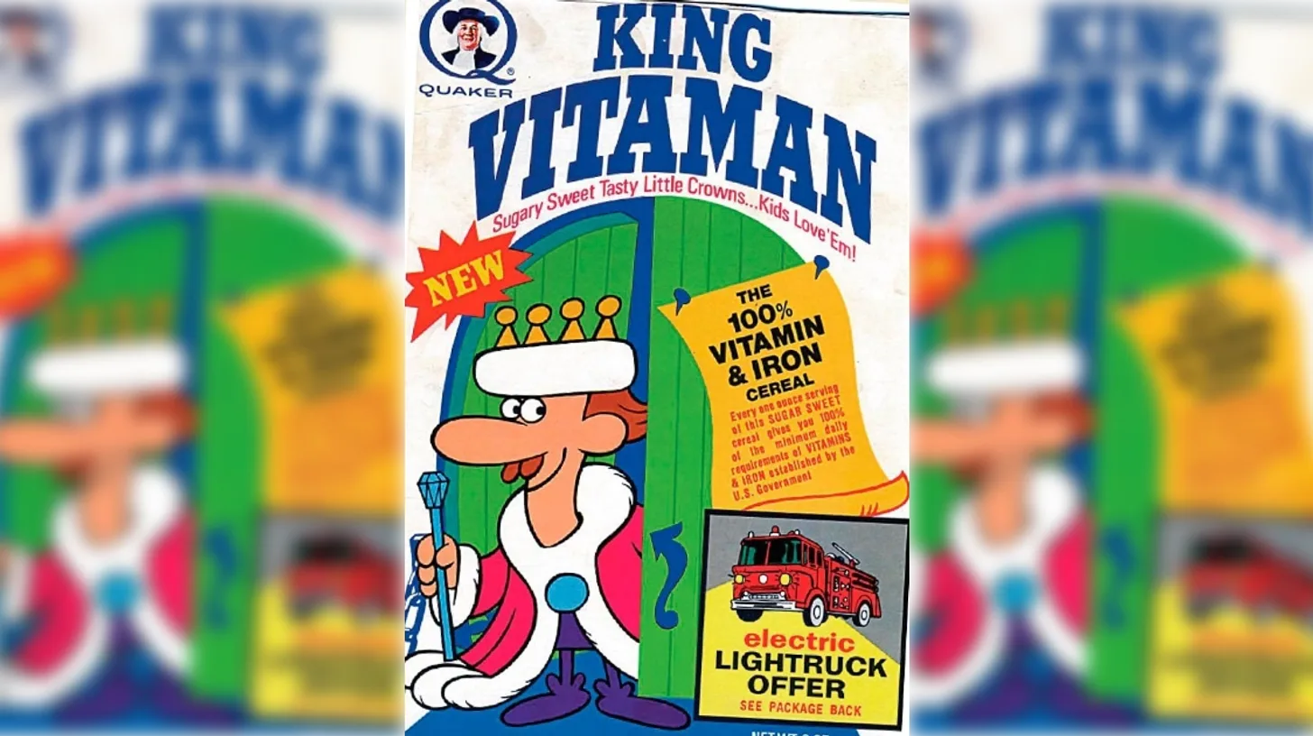 Quaker King Vitaman cereal box with the cartoon king mascot holding his scepter, a NEW starburst, a 100% vitamin and iron banner and an electric light truck offer