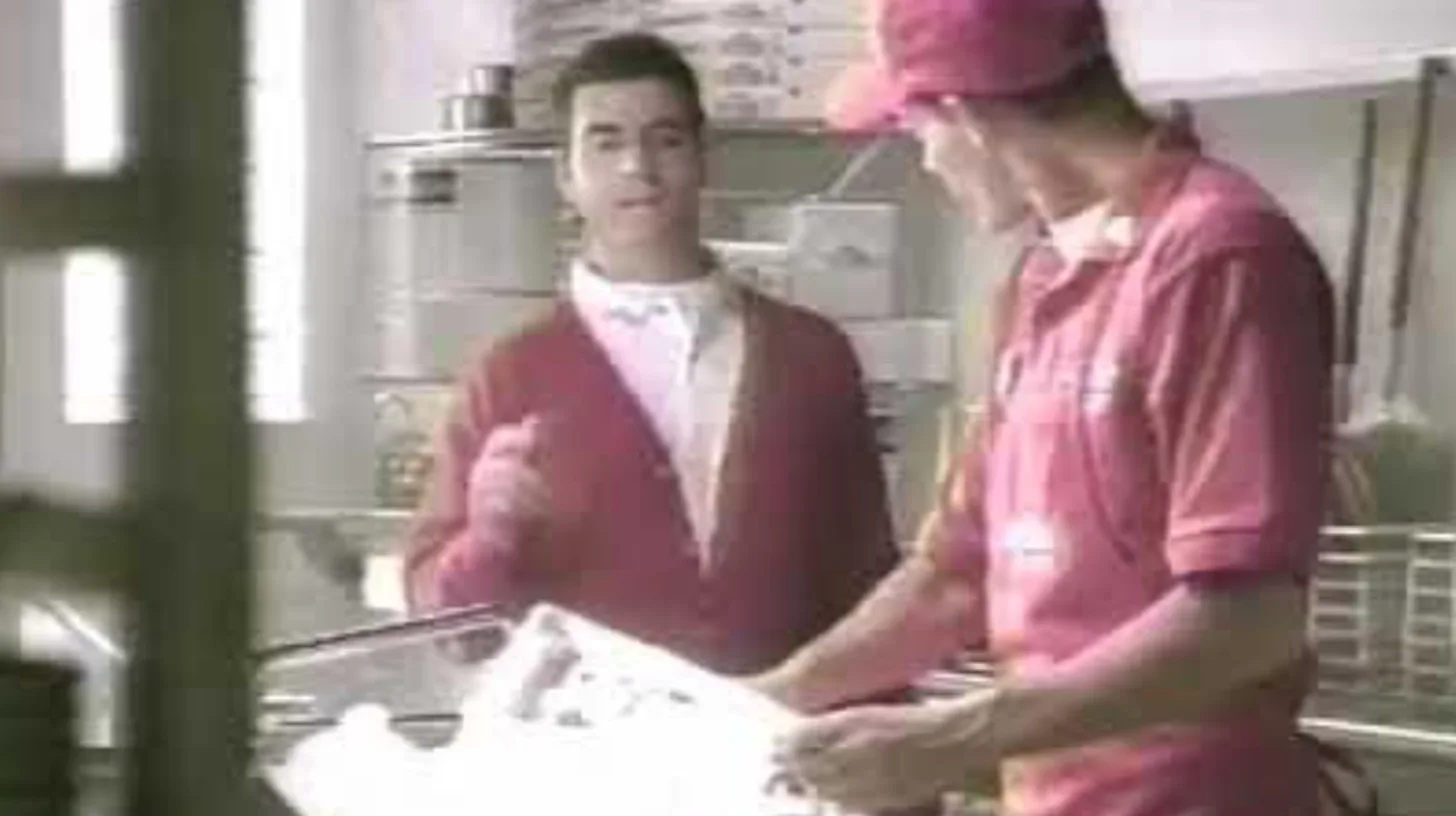 A kitchen scene from the 1997 TV campaign / Papa John's Papa John's workers making pizza in a scene from the 1997 TV campaign