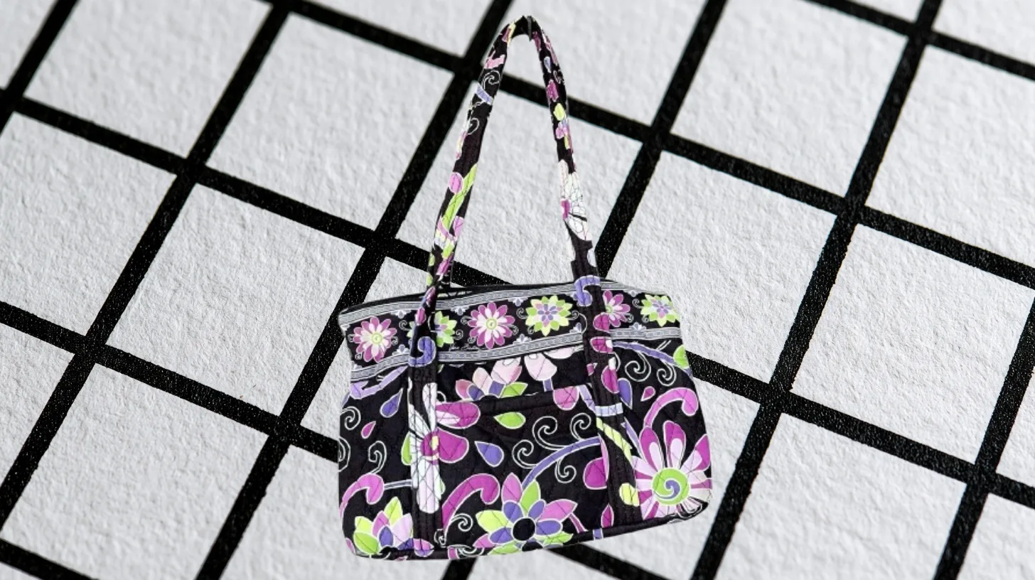 Purple Punch pattern — Vera Bradley Discontinued Vera Bradley Purple Punch handbag with magenta and green flowers