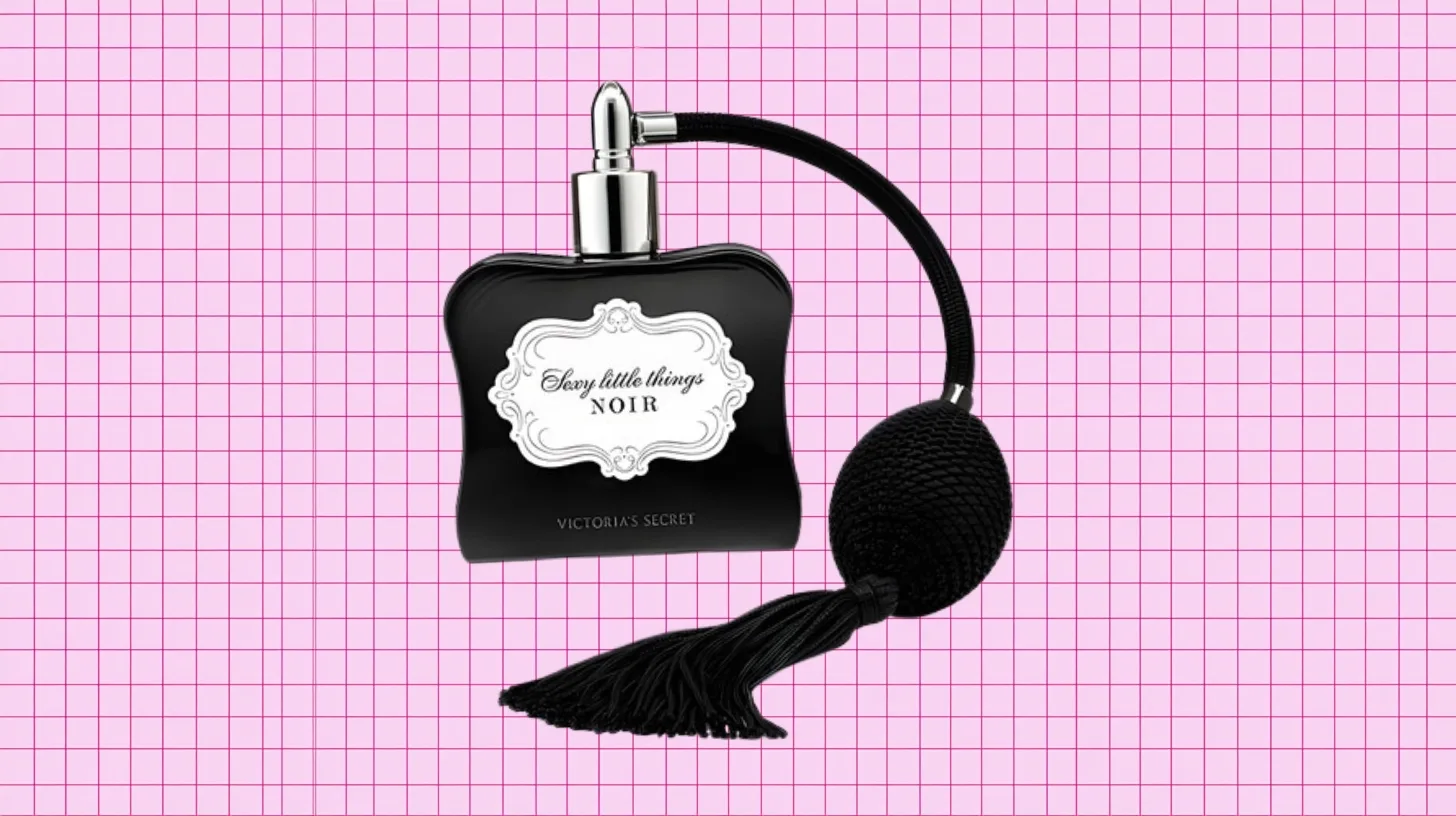 The discontinued Victoria's Secret Sexy Little Things Noir bottle in black glass with an ornate label and tasselled atomizer